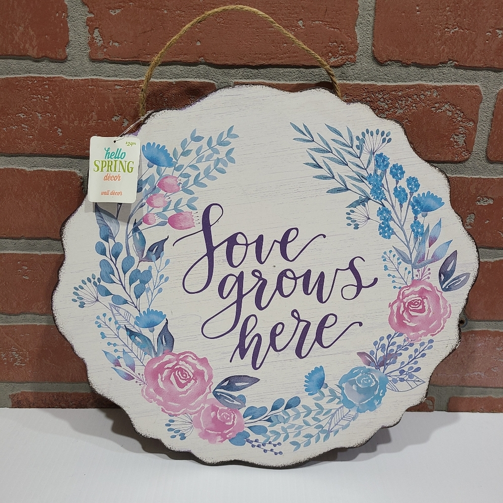Love Grows Here wooden floral sign